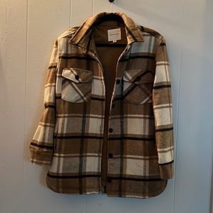 Tan plaid jacket size small. Thread and supply brand.